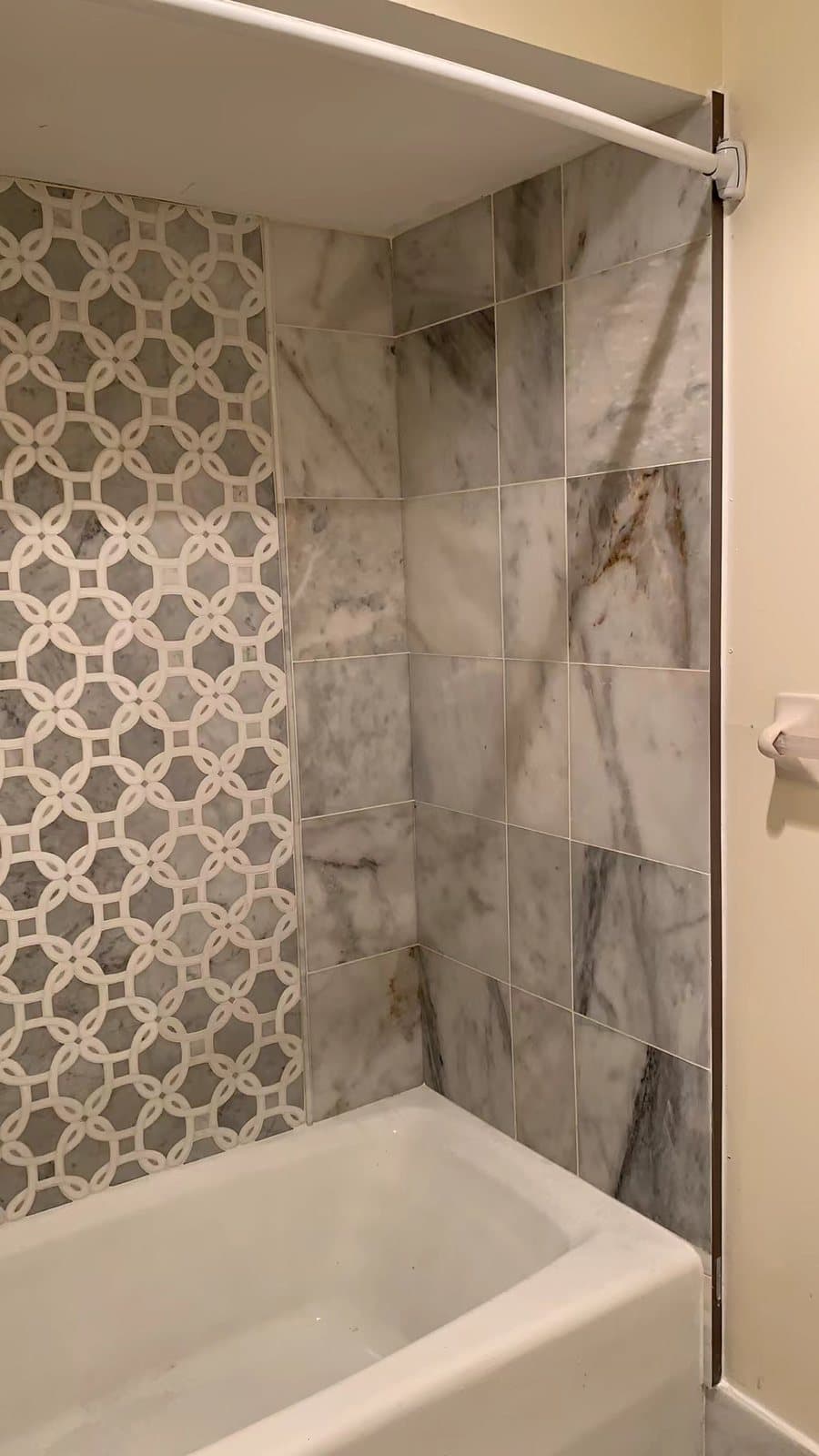 Stacked vertical tile with a polished chrome trim line